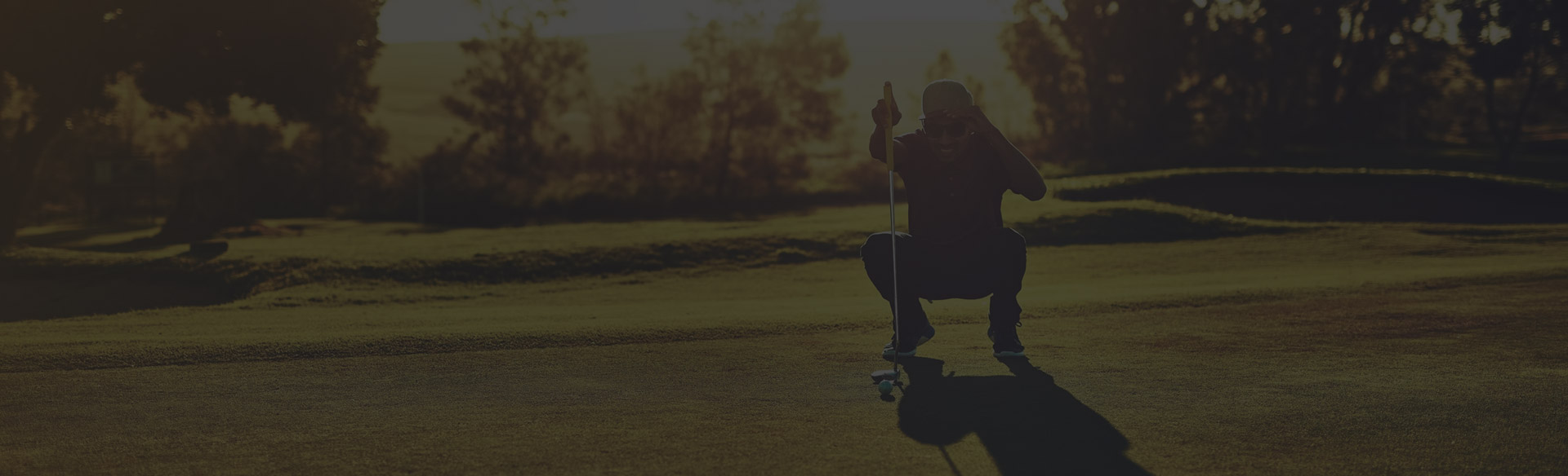 Golfer reading the green