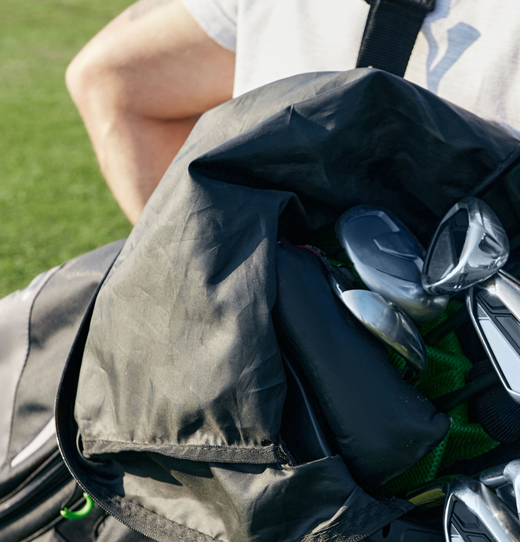 Golfer carrying bag tablet